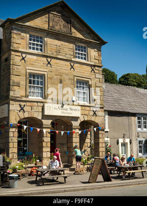 UK, England, Derbyshire, Hartington, Village Stores, customers sat at outdoor café tables Stock Photo