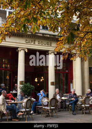 UK, Gloucestershire, Cheltenham, Promenade, Café Rouge, customers sat on pavement tables Stock Photo