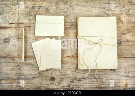 Stationery set on a wooden floor background. View from above. Stock Photo