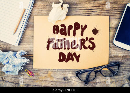 Office desk with Happy fathers day sign. View from above. Stock Photo