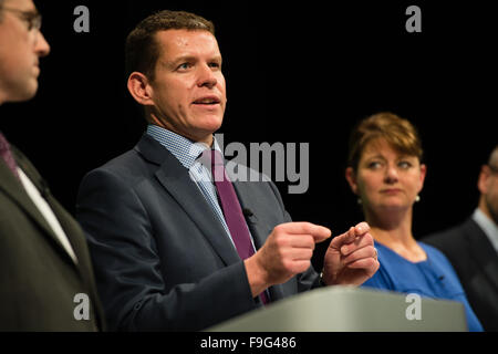 UK Politics: RHUN AP IORWERTH , member of the The Plaid Cymru 'shadow cabinet' on the platform at the party's 2015 Annual Conference at Aberystwyth Wales UK, watched by party leader LEANNE WOOD Stock Photo