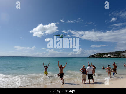 Maho beach in Saint Maarten in the Caribbean where aircraft fly low into Princess Juliana international airport Stock Photo