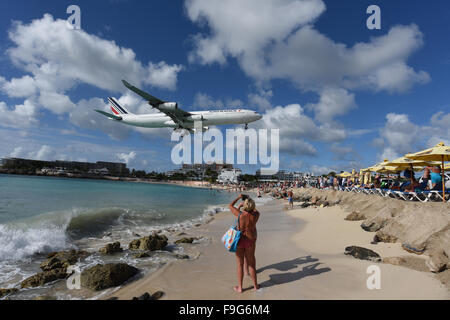 Maho beach in Saint Maarten in the Caribbean where aircraft fly low into Princess Juliana international airport Stock Photo