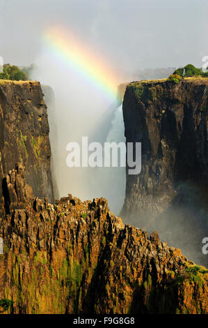 Rainbow over the Victoria Falls during dry season (September) from the Zambian side, Zambia Stock Photo