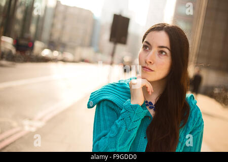 portrait of a young woman looking thoughtful Stock Photo