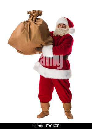 Santa Claus carrying big sack on his back full of christmas presents ...