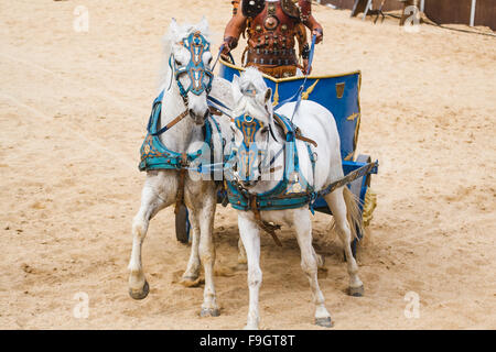 Roman chariot in a fight of gladiators, bloody circus Stock Photo