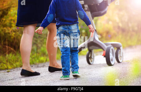 Mother and sons on a walk in nature enjoying life together. Stock Photo