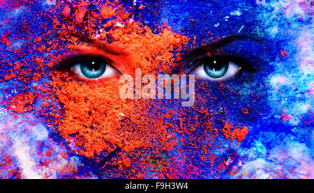 A pair of beautiful blue women eyes beaming, color earth effect, painting collage, violet makeup Stock Photo