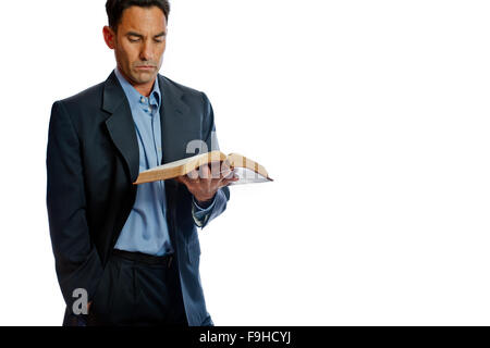 Middle age man in suit reading the Bible Stock Photo