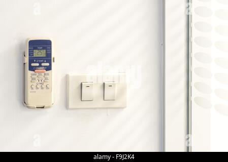 remote control air conditioner on the wall Stock Photo