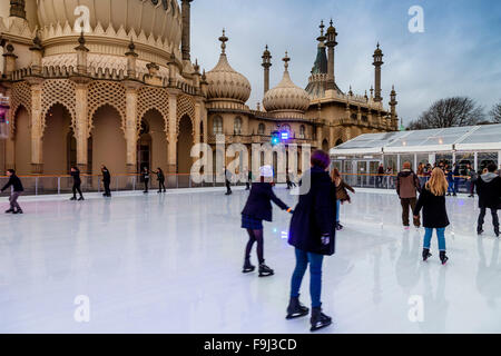 Young People Skating On The Ice Rink Outside The Royal Pavilion, Brighton, Sussex, UK Stock Photo