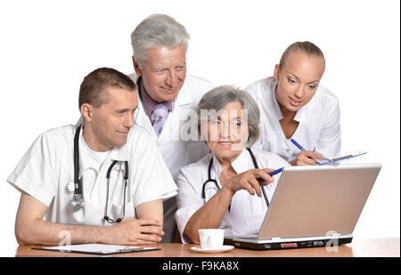 Doctors discussing at table Stock Photo