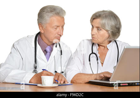 Doctors discussing at table Stock Photo