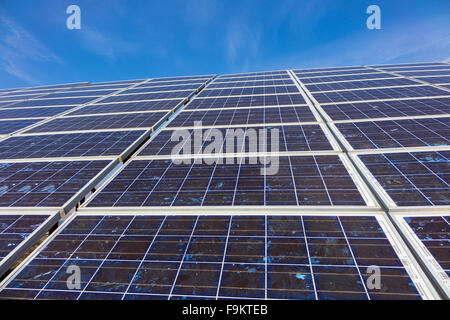 Solar panels against blue sky, perspective Stock Photo