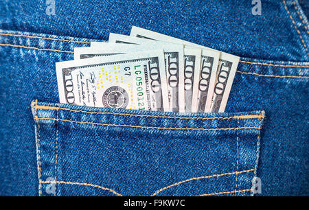 Banknotes of american dollars in the back jeans pocket Stock Photo