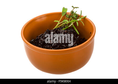 Black boiled rice with thyme Stock Photo