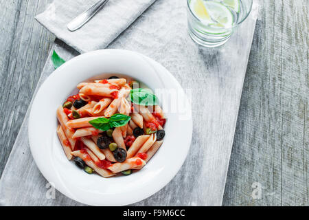 pasta with tomato sauce olives and capers Stock Photo