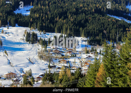 Alpine chalet rooftops covered with snow in the Alps ski resort in mid winter in salzburg,  Austria, Europe. Stock Photo