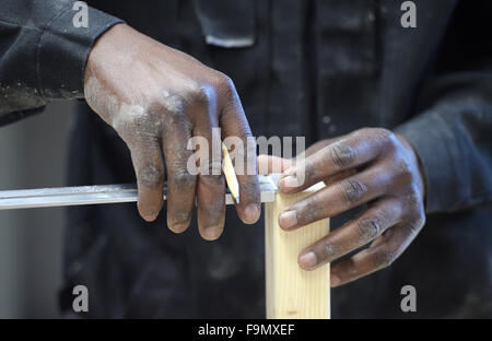 Berlin, Germany. 17th Dec, 2015. A refugee working in the carpentry workshop as part of the Berlin Chamber of Trades refugee initiative 'Arrivo' in Berlin, Germany, 17 December 2015. Photo: RAINER JENSEN/dpa/Alamy Live News Stock Photo