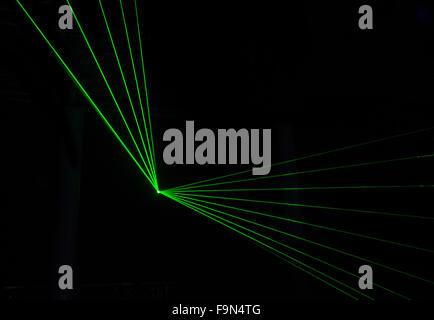 Green Laser effect over a plain black background. Stock Photo