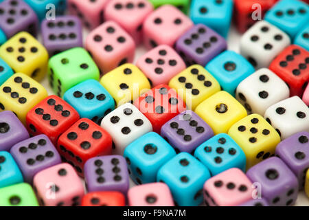 many small colorful plastic  dice isolated on white background Stock Photo