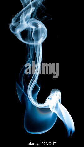 wisp of smoke on black background Stock Photo