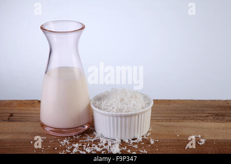 jar of coconut milk and shredded coconut Stock Photo