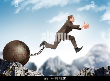 Businessman jumping over gap Stock Photo