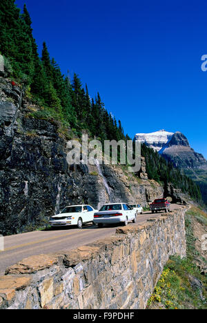 Glacier National Park, Montana, USA - Cars passing slowly along a steep narrow Going to the Sun Mountain Road Stock Photo