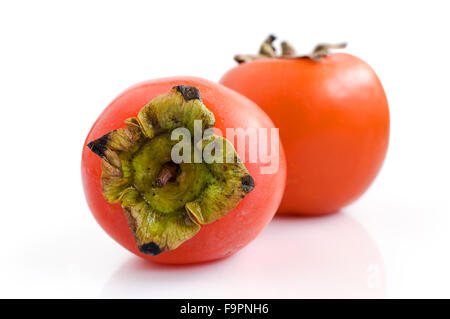 Two persimmons isolated on white background Stock Photo