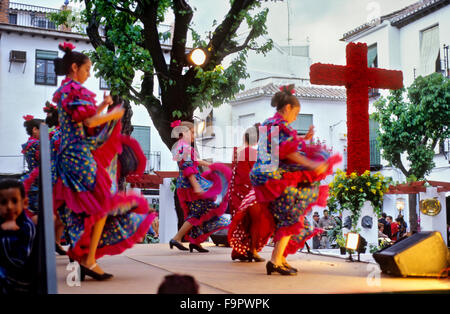 Dia de la Cruz, floral cross and dancers, in Plaza Larga,Albaicin quarter, Granada, Andalucia, Spain Stock Photo