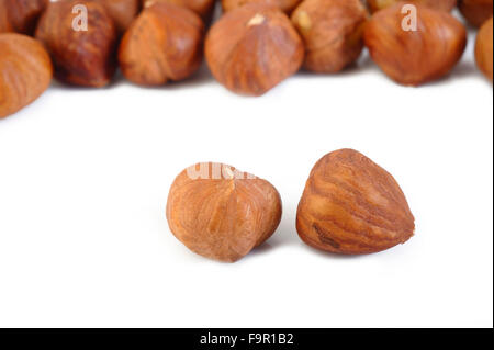 peeled hazelnuts isolated on white background Stock Photo