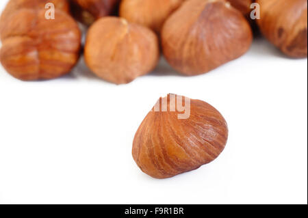 peeled hazelnuts isolated on white background Stock Photo