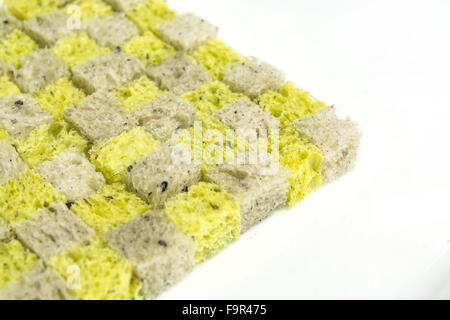 pumpkin and black sesame bread, dice bread conner on white background Stock Photo