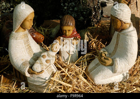 Christmas crib in a caholic church. Nativity scene. The holy Family. Stock Photo