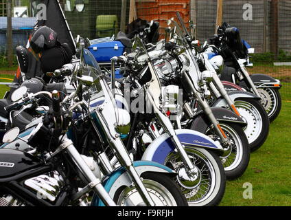 Harley-Davidson Motorbikes lined up on a lawn Stock Photo