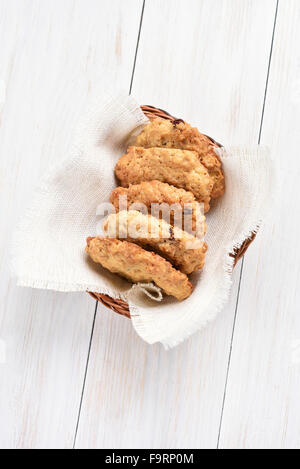 Homemade healthy cookies from oats on white wooden table, top view Stock Photo