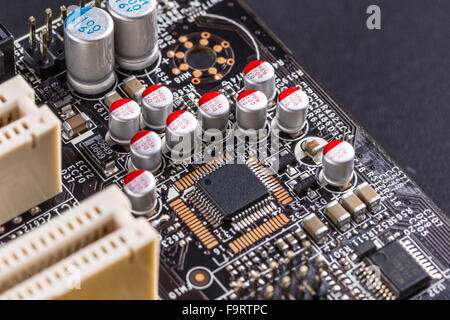 Microchips and condensers assembly on the circuit board Stock Photo