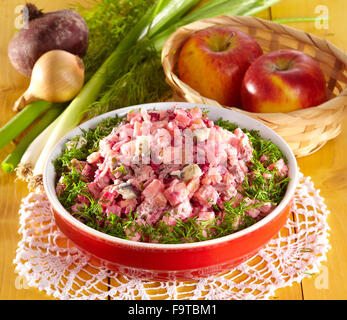 Salad Rossolye (Potato salad with beetroot,, herring and beef meat ...