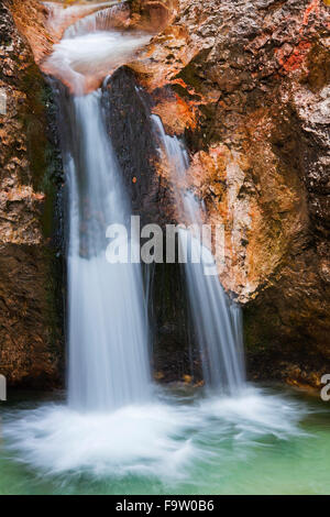 Waterfall in the river Almbach running through the Almbachklamm canyon in the Berchtesgaden Alps, Bavaria, Germany Stock Photo