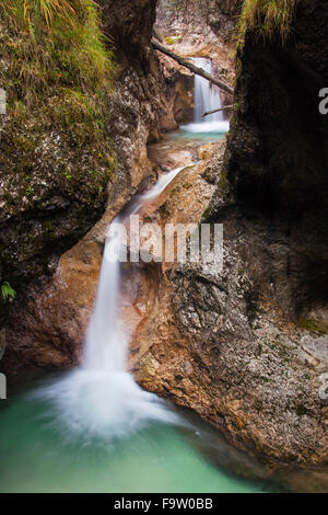 Waterfall in the river Almbach running through the Almbachklamm canyon in the Berchtesgaden Alps, Bavaria, Germany Stock Photo