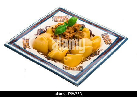 Lumaconi with pork and basil Stock Photo
