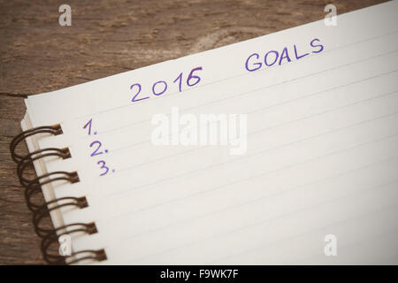 Notebook with goals of year 2016 on wooden background. Selictive focus Stock Photo