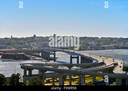 A landscape view of the Harbor Bridge sweeping across mouth of the Saint John river in Saint John New Brunswick Canada. Stock Photo