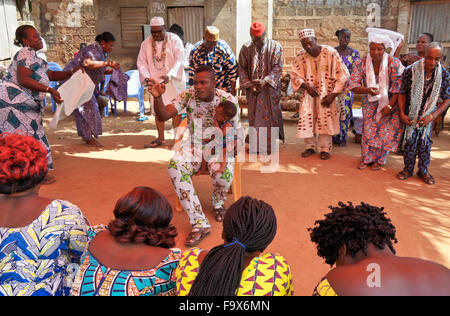 Ewe priest, priestess, dignitaries, and others participating in a Tron vodun (voodoo) ceremony, Lome, Togo Stock Photo