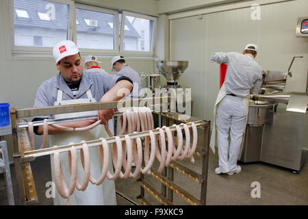 Butcher making sausages. Stock Photo