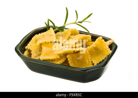 Ravioli with herbs isolated on white Stock Photo
