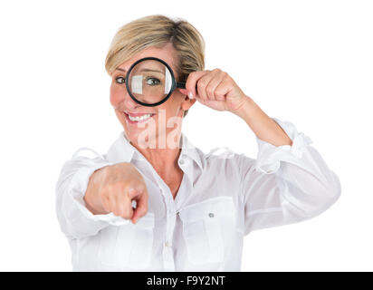 manager woman looking through magnifying glass Stock Photo