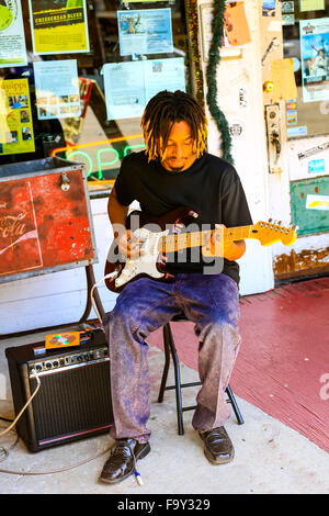 Black young man playing his guitar and singing the blues in Clarksdale Mississippi Stock Photo